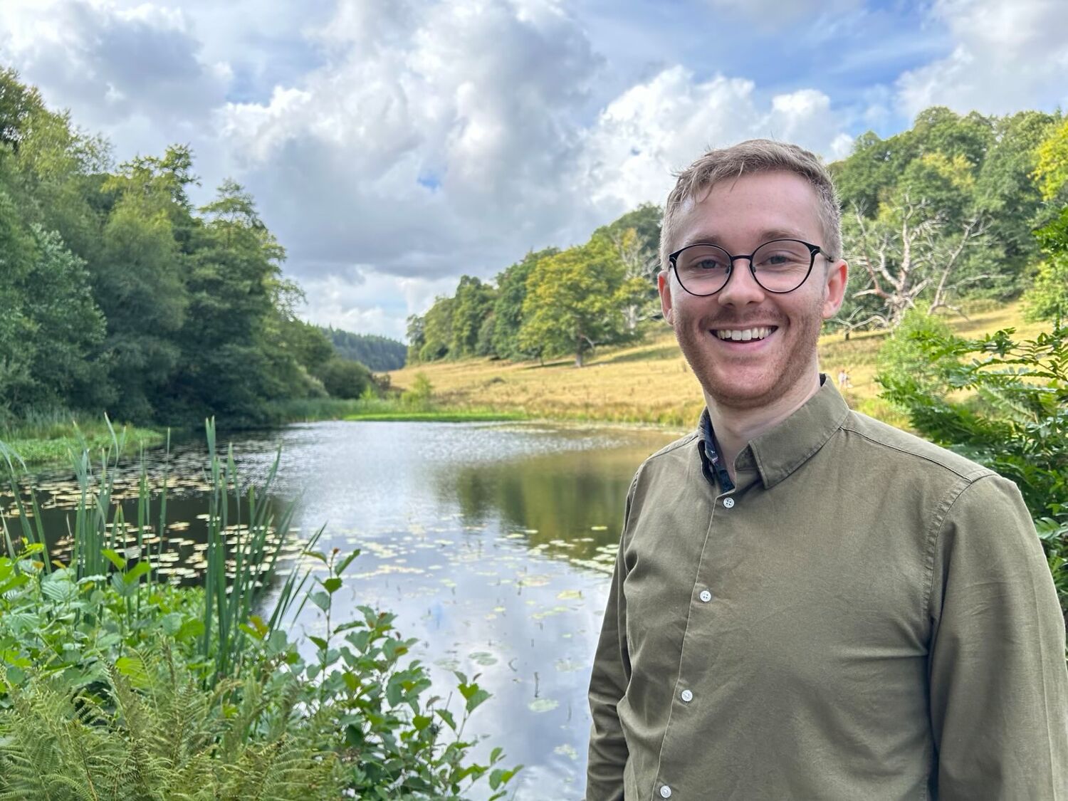 Focused craftsman using lathe in woodworking workshop